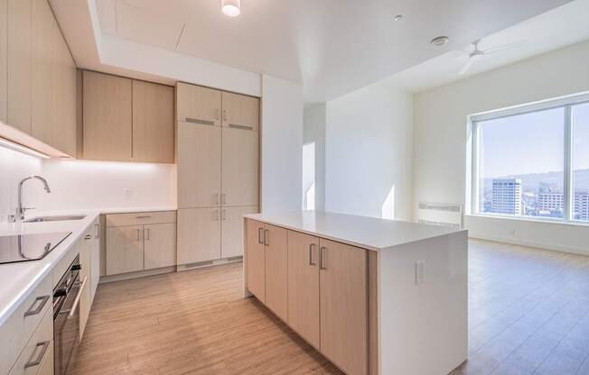 A kitchen with wooden floors and white appliances.