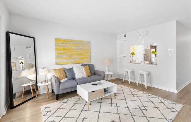 Stylish apartment living space at Monon Living in the heart of Broad Ripple with cozy seating, open breakfast bar, and walkable access to the Monon Trail.