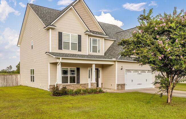 Welcome to this charming 4-bedroom, 3.5-bath home in Raeford