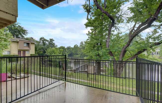 the preserve at ballantyne commons balcony guard rail with trees and a river