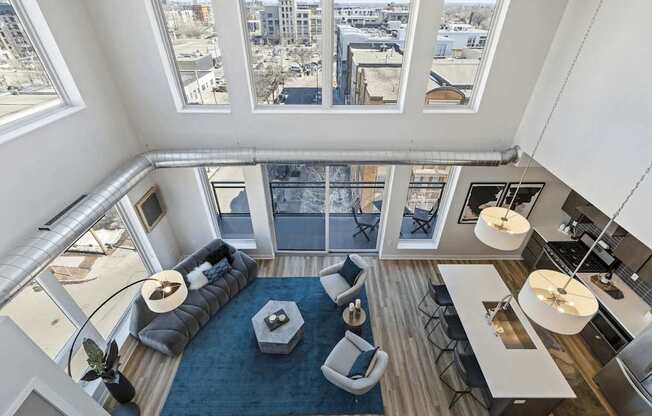 A modern living room with a view of the city.