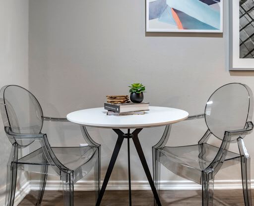 a table with two chairs and a plant on top of it at Elme Alexandria, Alexandria, VA