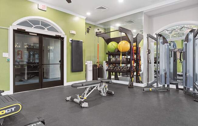 Community Fitness Center with Equipment at Vinings at Hunter's Green Apartments in Tampa, FL.