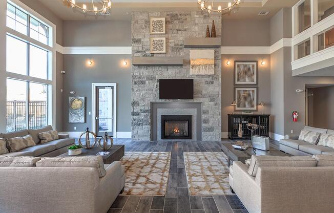 a living room filled with furniture and a fire place