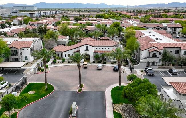 an aerial view of a neighborhood with houses and cars