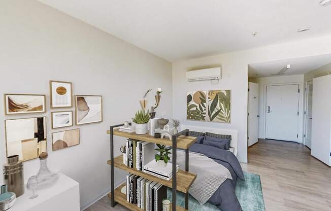 a bedroom with a bed and a bookshelf in front of it