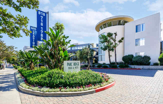 the building in which the hotel is located is a large white building with a sign