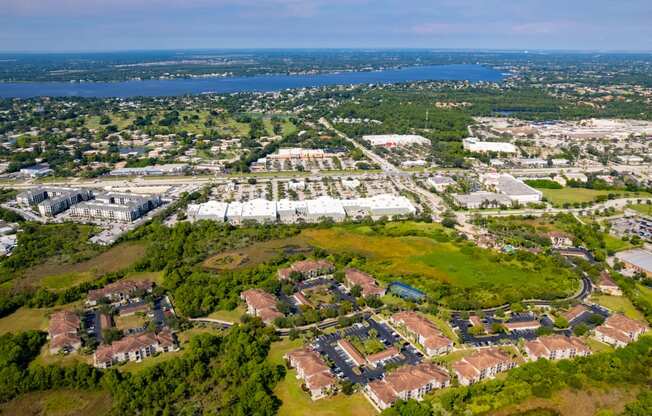 an aerial view of a city with a body of water in the background at Heritage Bay, Jensen Beach, FL