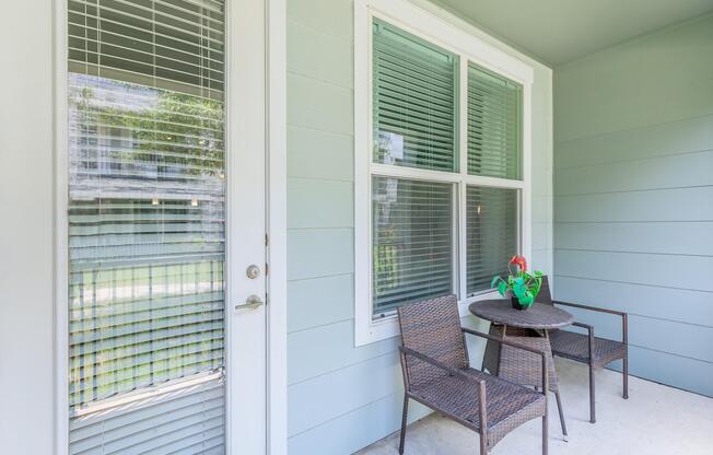 a chair sitting in front of a window