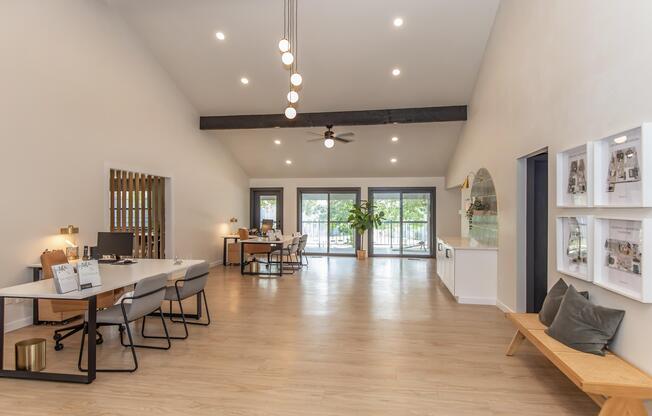 a living room filled with furniture and a wood floor