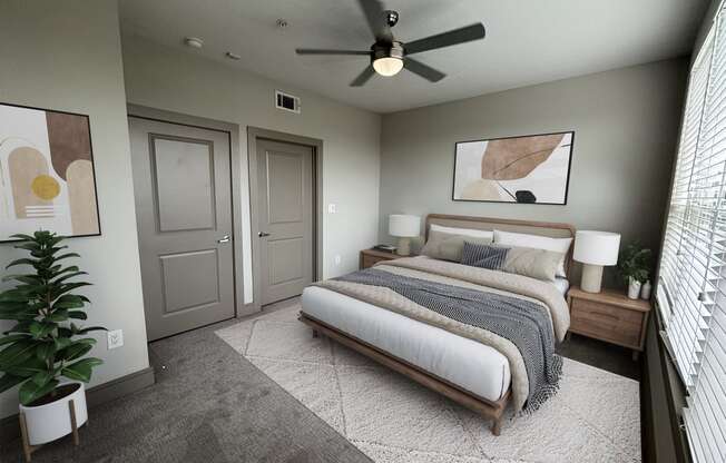 a bedroom with a bed and a ceiling fan