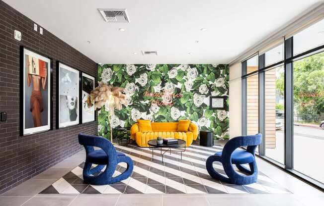 Living room with a checkered floor and a wall covered in floral wallpaper at Edendale Crossing, Los Angeles, CA 90026