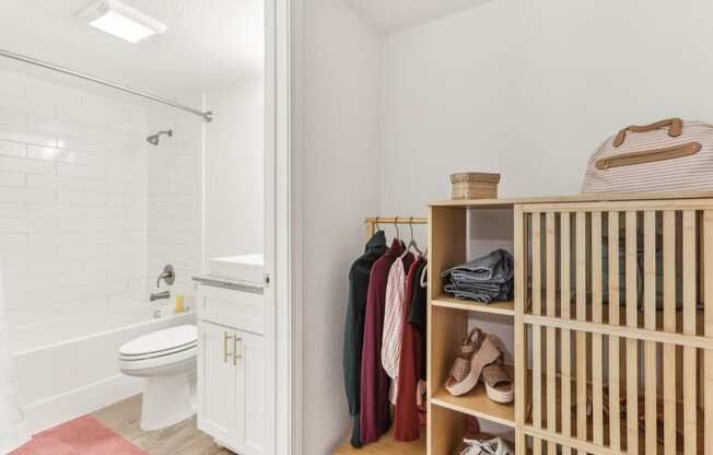 a bathroom with a crib and a toilet and a shower