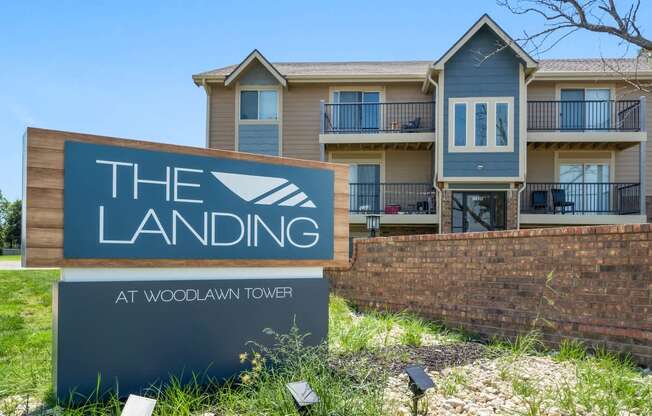 the landing sign in front of an apartment building