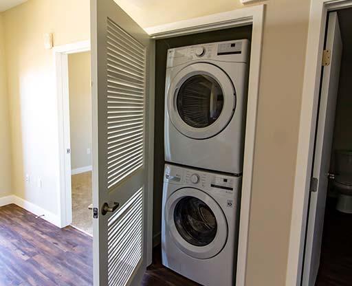 washer and dryer in a small room at Loma Villas Apartments in San Bernardino, CA