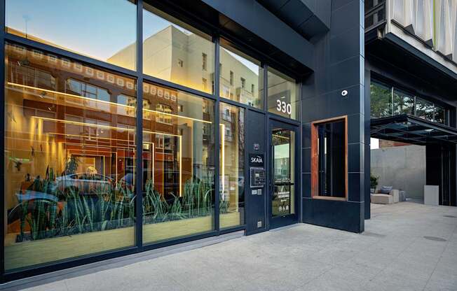 A modern building with glass doors and windows.