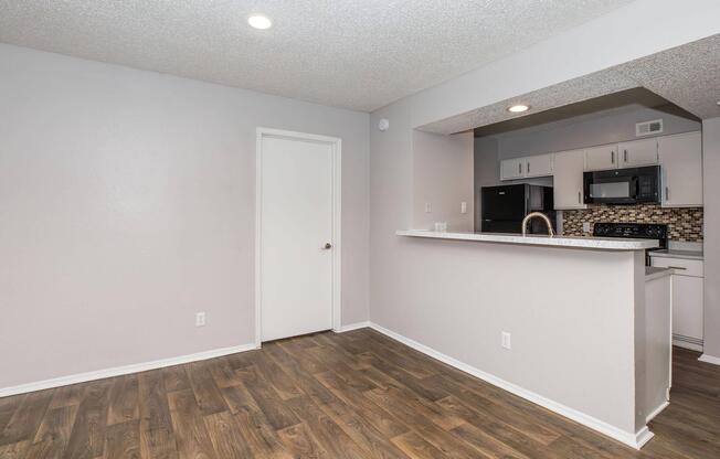 a kitchen with a wood floor