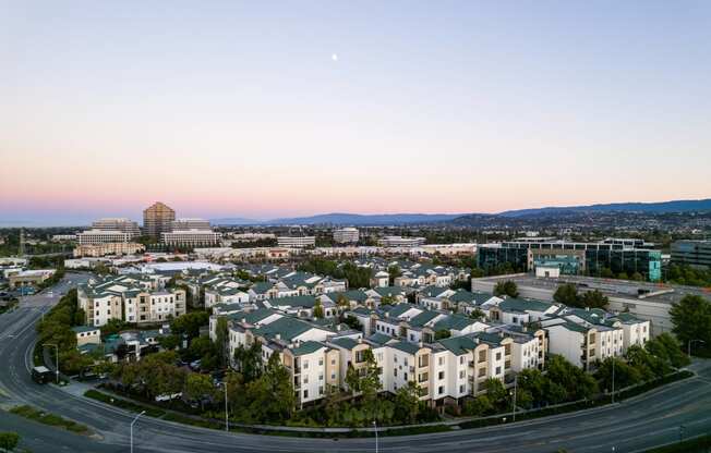 an aerial view of the city at sunset