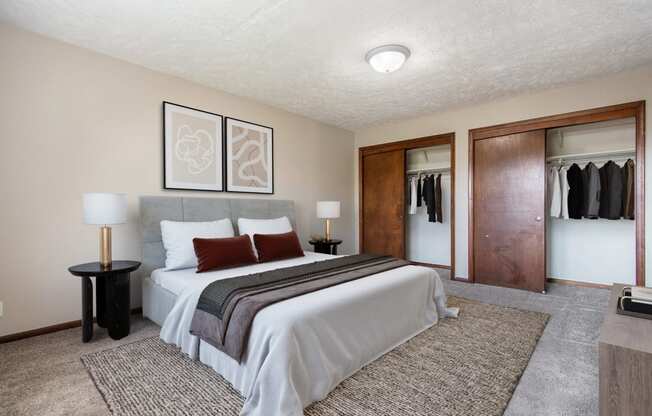 Omaha, NE Maple Ridge Apartments. A bedroom with a bed and a closet