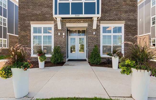 The front of a building with a glass door and windows.
