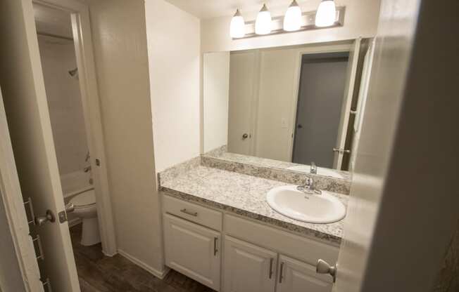 This is a photo of the bathroom of the 1084 square foot 2 bedroom townhome at The Biltmore Apartments in Dallas, TX.