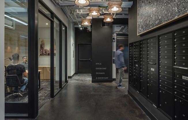 a view down the hallway of a large room with lockers and a sign that says f