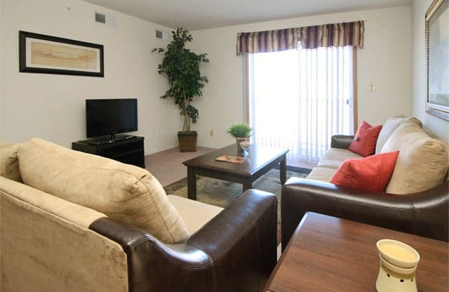 Living Room With Patio Access at Van Horne Estates Apartments, El Paso, TX, 79934