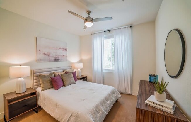 Model bedroom with carpeting and fan