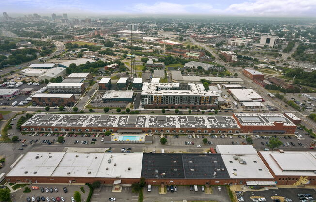 an aerial view of a large industrial area with several buildings and parking lots