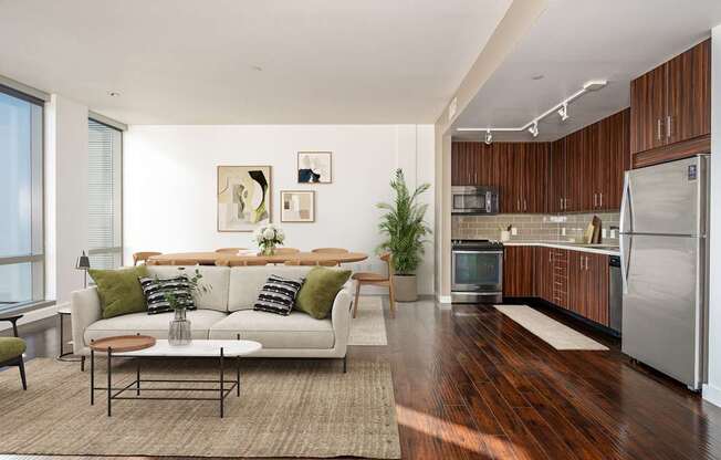 A modern living room with a white couch and a coffee table.