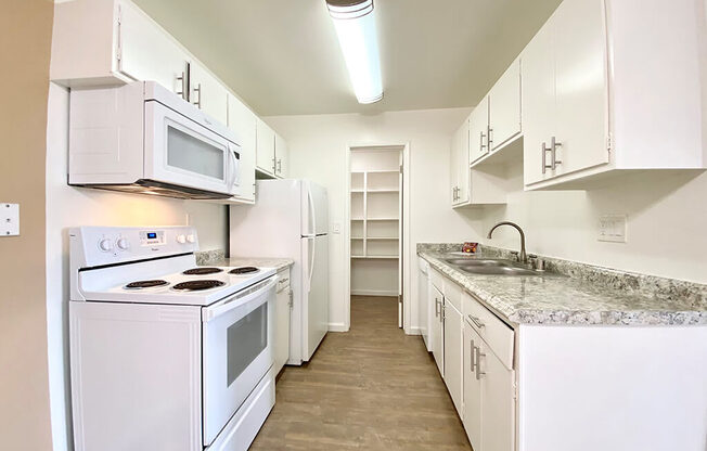 Kitchen With White Cabinetry And Appliances at The Monterey, San Jose, CA