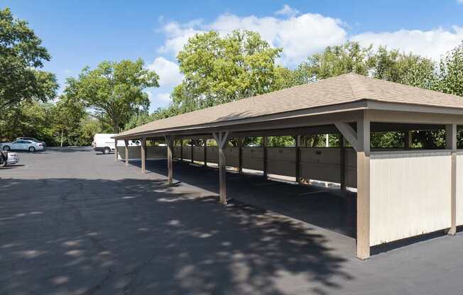 A large covered parking area with a concrete floor.