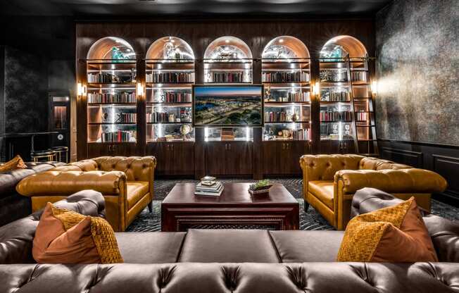a living room with couches and a coffee table at The Alibi at Lake Lilly, Ocoee, 34761