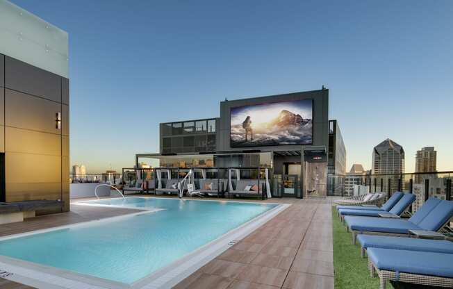 rooftop resort style pool with TV at Luma