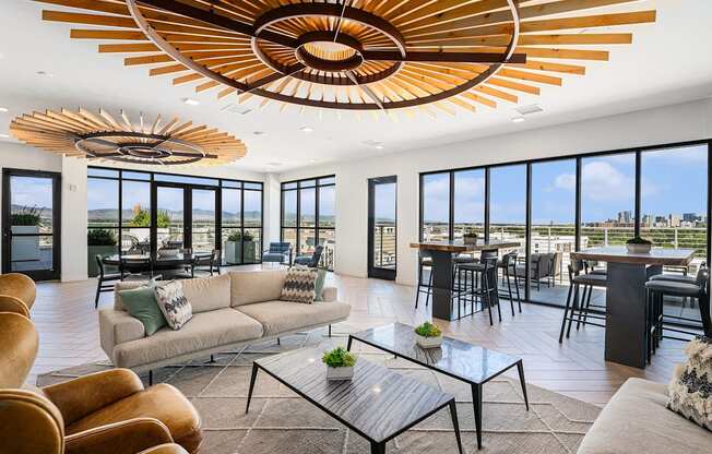 A modern living room with a large window overlooking the city.