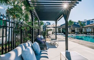 Pergola and poolside seating at Tampa's apartment building, The Pointe on Westshore
