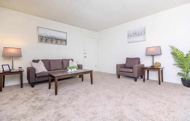 a living room filled with furniture and a table