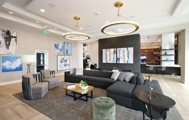a living room with couches and chairs and a table