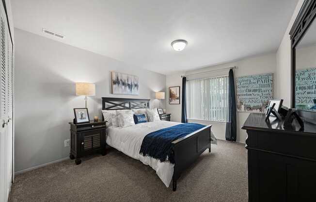 Spacious bedroom with ample storage space at Knottingham Apartments in Clinton Township, MI.