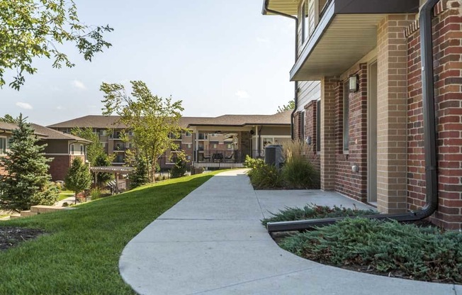 Sidewalk through Villas of Omaha townhome apartments in northwest Omaha NE 68116