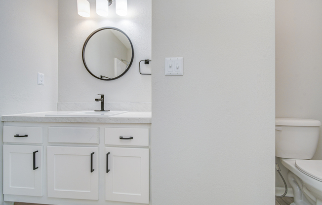 Sink and amenities in townhome platinum bathroom interior at The Arbor in Blue Springs, Missouri