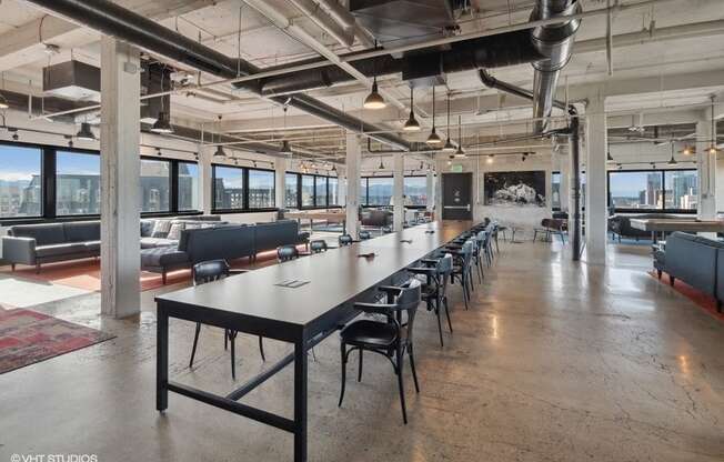 A large conference room with a long table and chairs at Archer Tower in Denver, CO