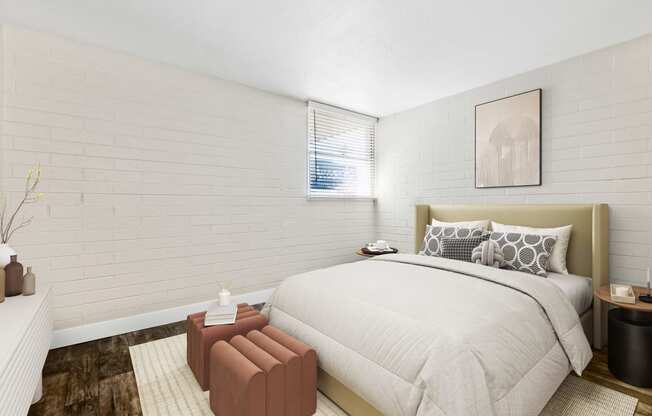 Model Bedroom with Wood-Style Flooring and Window View at Arcadia on 49th Apartments located in Phoenix, AZ.