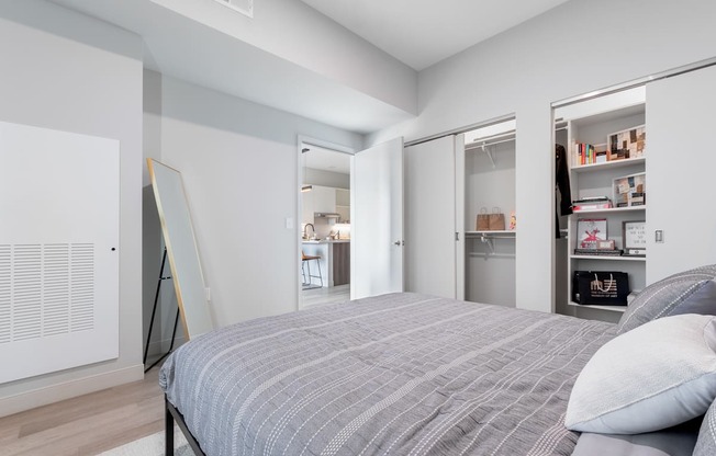 Bedroom with queen bed at TREO Apartments, Ohio