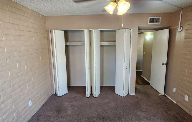 2x2 Downstairs Brown Upgrade Guest Bedroom with Closets at Mission Palms Apartment Homes in Tucson AZ