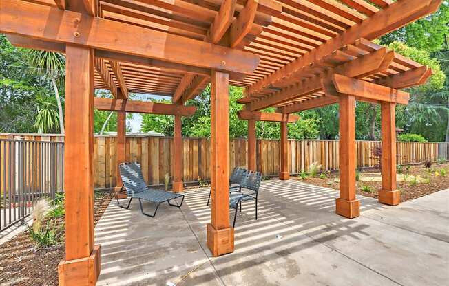 Outdoor shaded overhang with lounge chairs