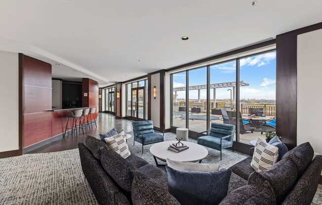 a living room with a couch and chairs and a table