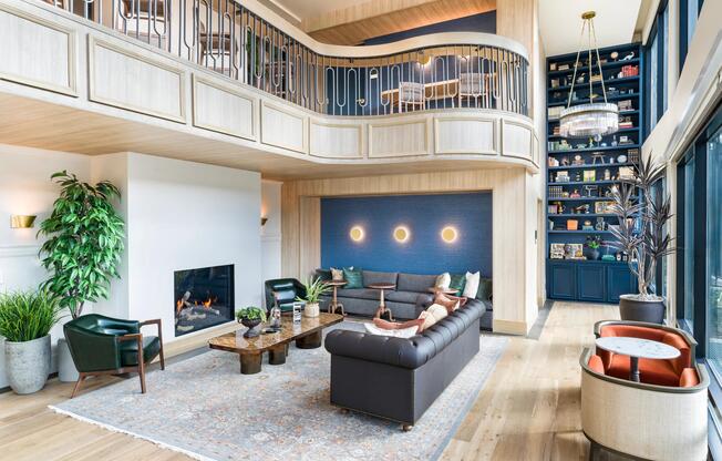 Expansive clubroom with fireplace and lounge seating at Modera University Park.