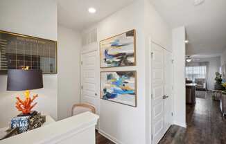 A living room with white walls and two paintings on the wall  at The Meadows, Bloomingdale, Georgia