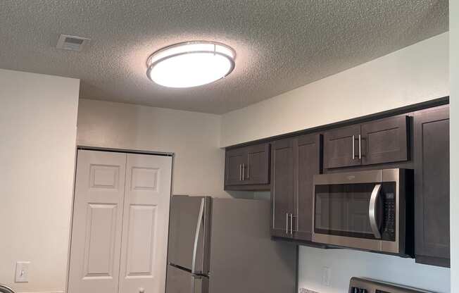 a kitchen with granite counter tops and stainless steel appliances